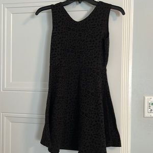 Black leopard dress. So cute and stylish. V neck front.